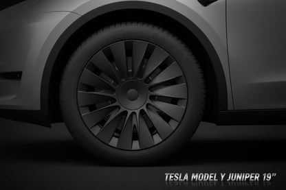 Close-up of a car wheel with a black rim and tire on a vehicle.