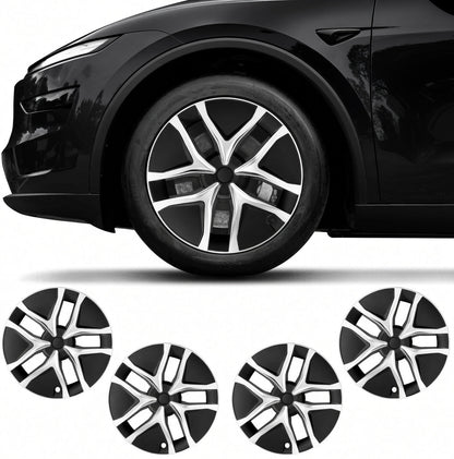 Four black and silver multi-spoke wheel covers shown below a black car wheel on a white background. TESLA_MODEL_JUNIPER_19_WHEEL_PERFORMANCE_PREMIUM_ARACHNID_BUY_FROM_THE_TESLA_ACCESSORIES_SPECIALISTS_WITH_FREE_DELIVERY_ACROSS_EUROPE_TESLARY.EU_TESLARY.PT_TESLARY.ES